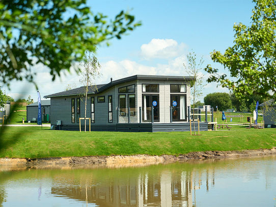 Prestige Glasshouse on lakeside plot